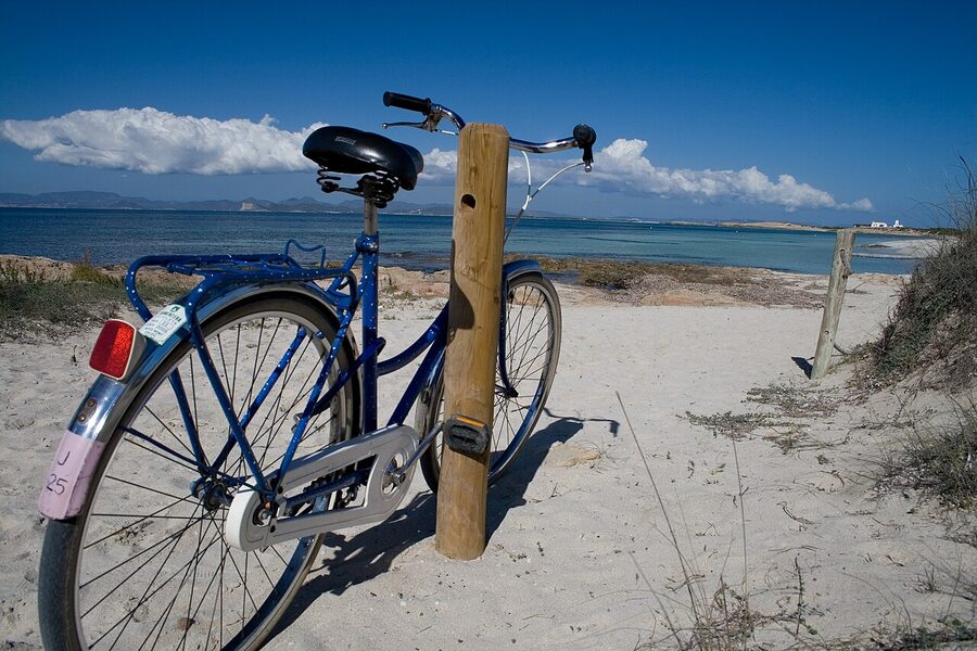 Bicycle leaning on the beach at Platja de Ses Illetes Formentera