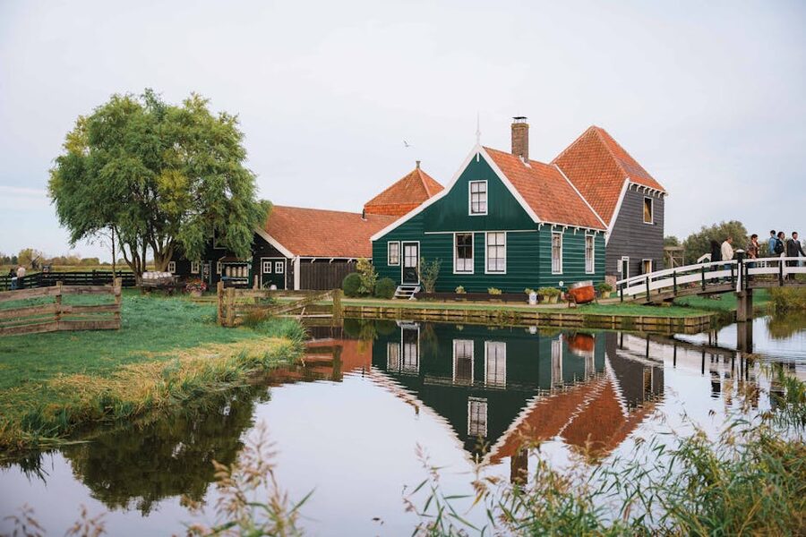 Dutch farmhouse reflected in a calm pond at Zaanse Schans