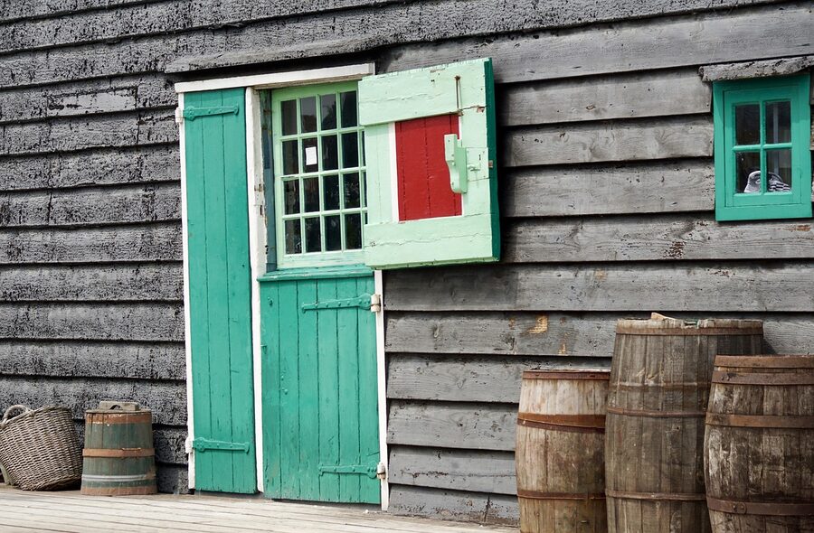 Inside a Zaanse Schans windmill with wooden storage barrels